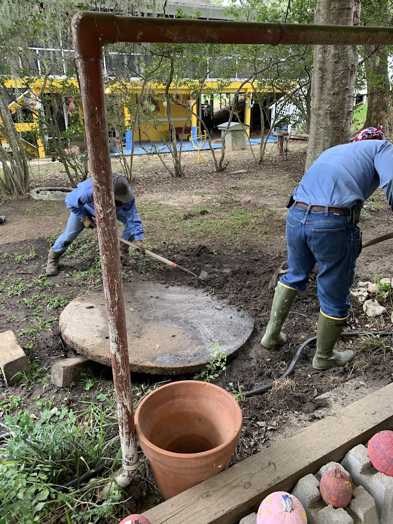 Septic system cleaning service in progress